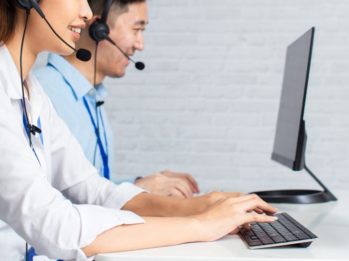 IT Support professionals working at computers at Coastal IT